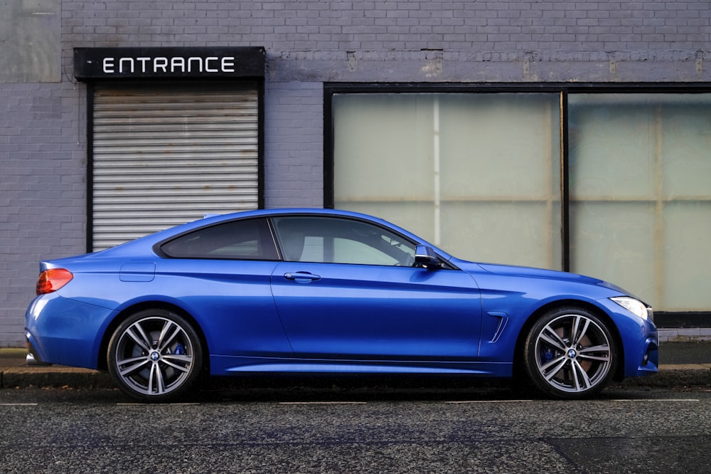 Blue car parked on the street representing AZK auto insurance coverage